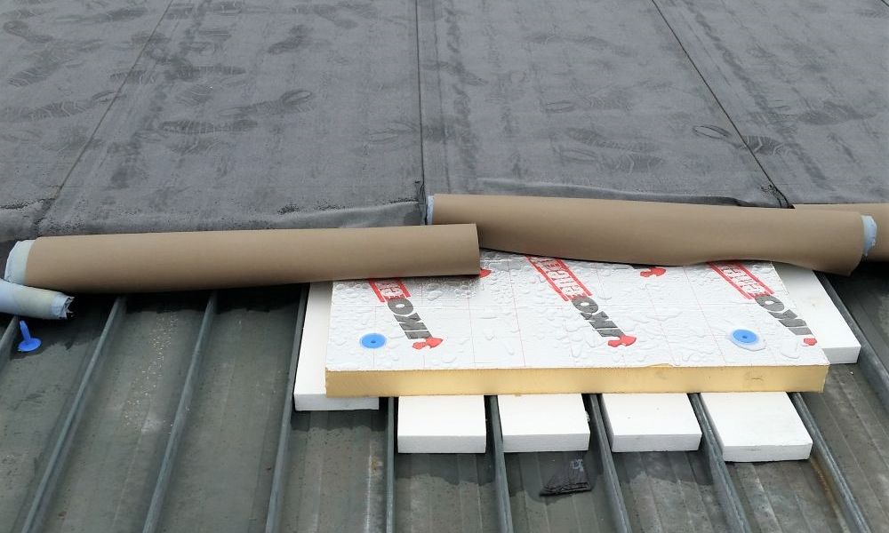 Nuratherm system being overlaid on existing metal tray roof